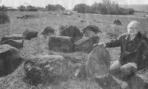 Grant Keddie with reconstructed cairns